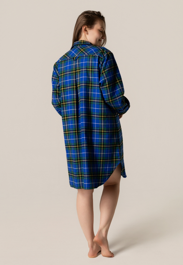 Person wearing anova scotia tartan nightshirt against a beige background