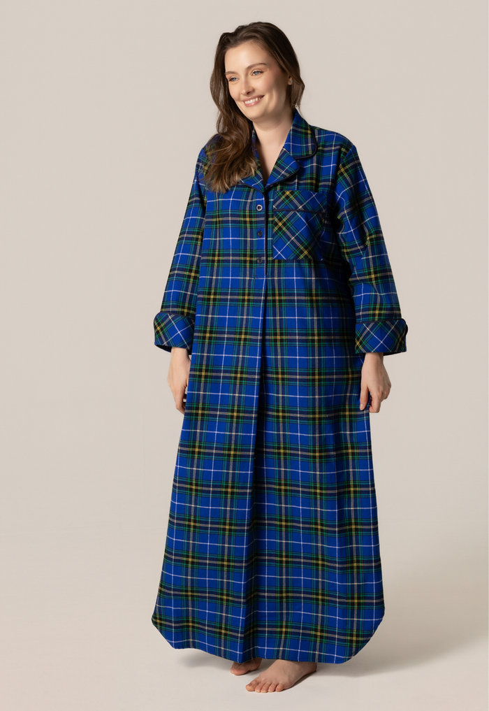 Woman wearing a blue plaid nightshirt on a beige background