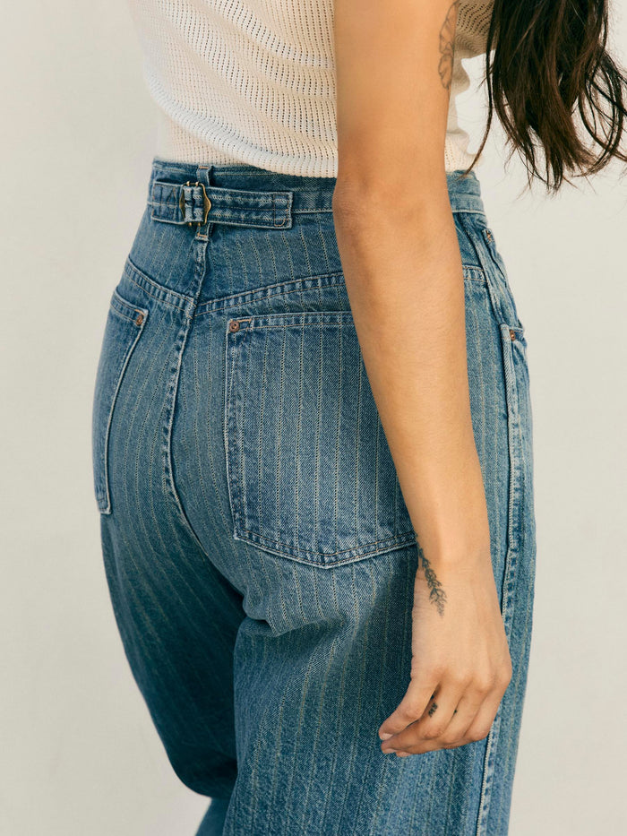 Light Gray buckleback jean in washed indigo stripe