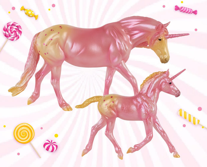 Cotton Sparkle and Sugar Puff on a pink swirl background with candy