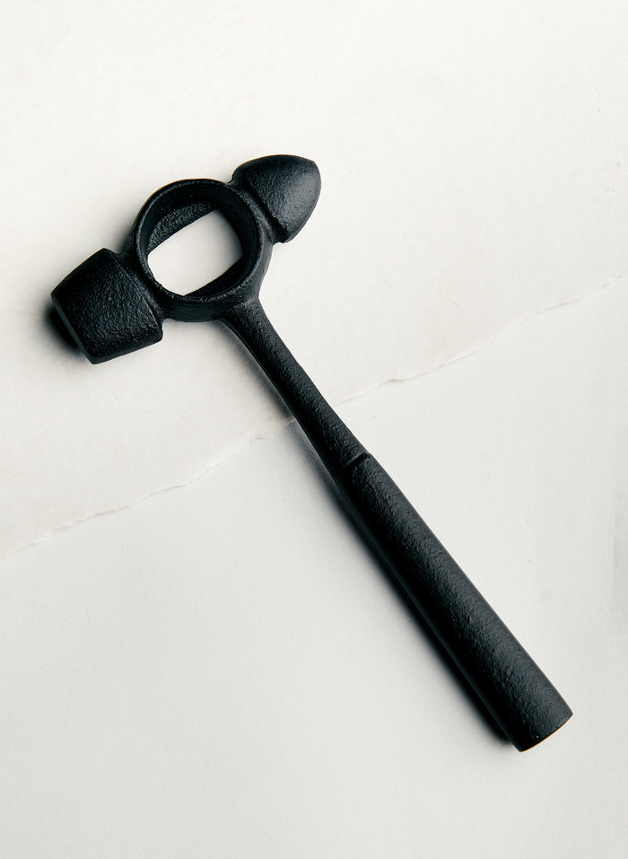 Beige cast iron hammer bottle opener