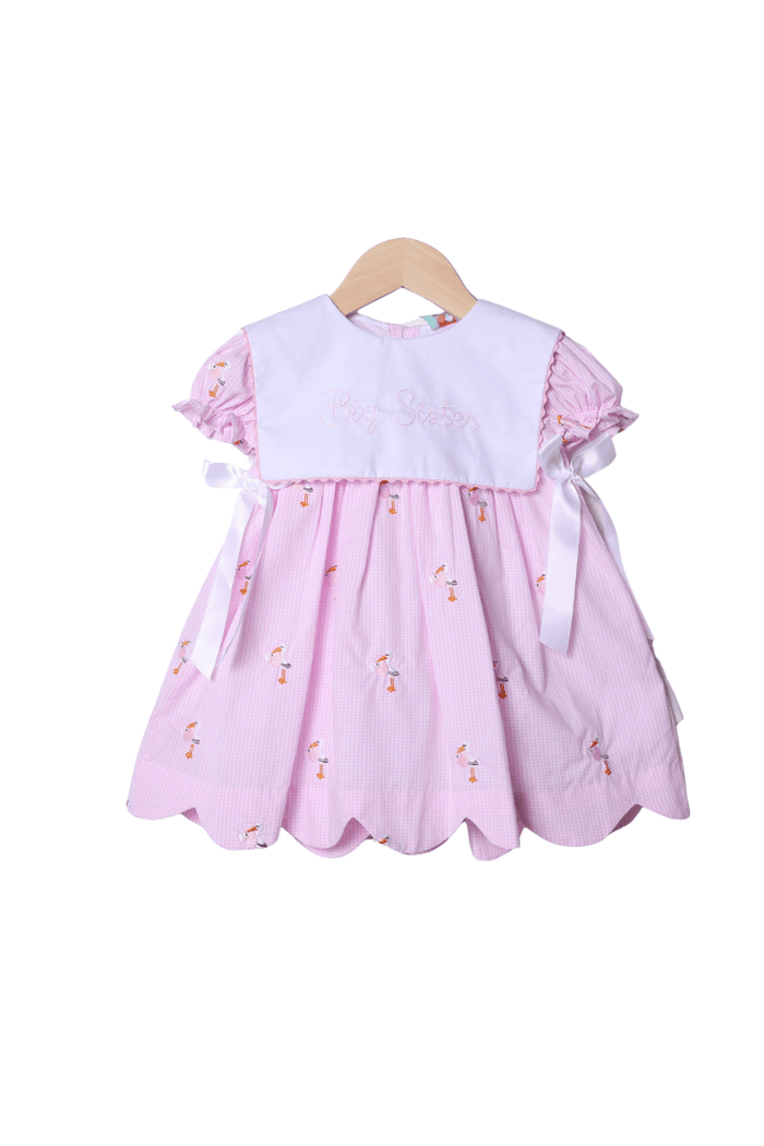 The Smocked Flamingo Embroidered Big Sister Stork Bib Dress