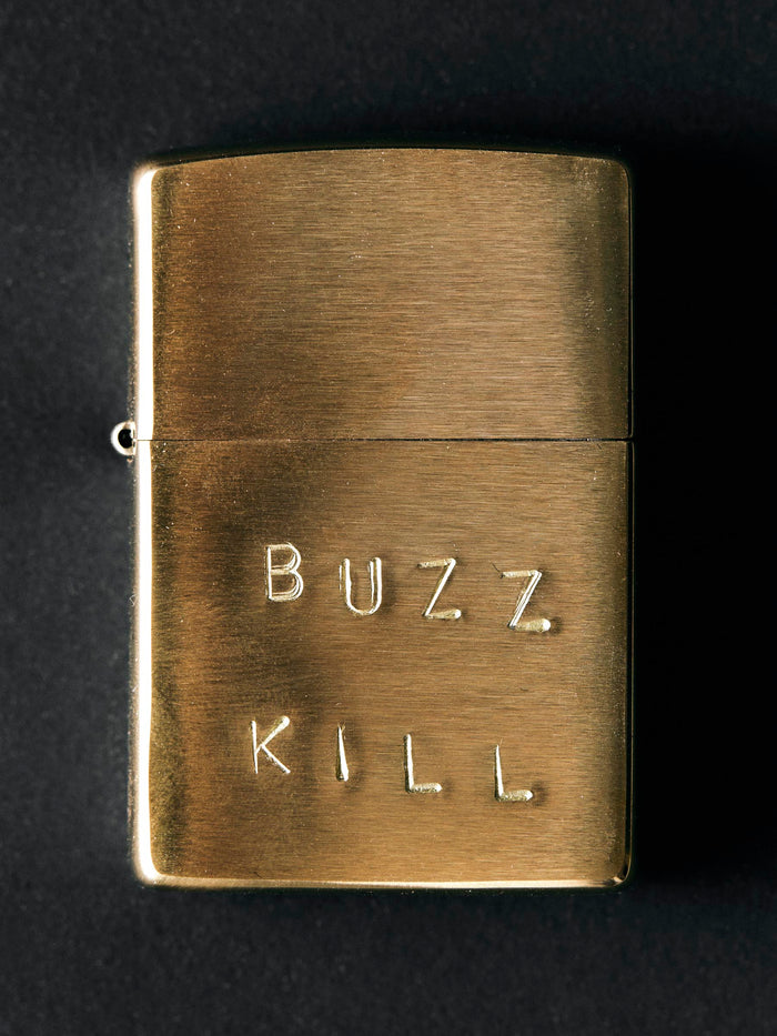 Black hand stamped “buzz kill” zippo