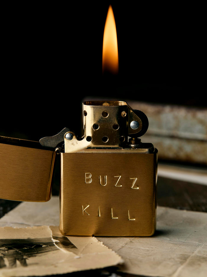 Black hand stamped “buzz kill” zippo