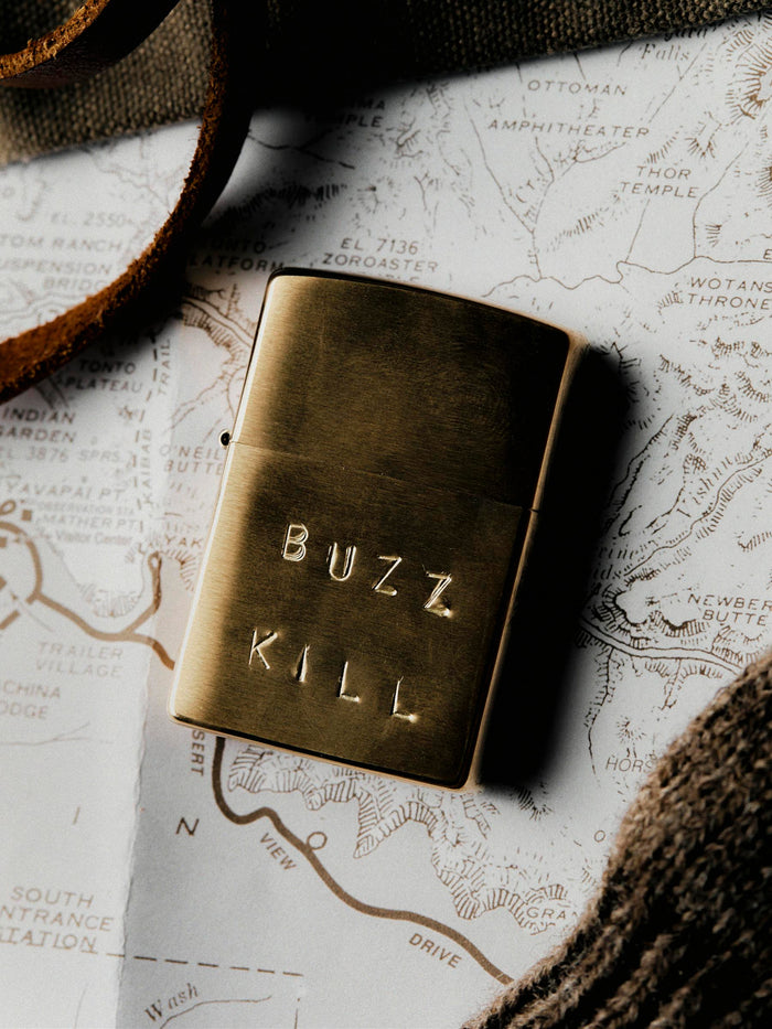 Gray hand stamped “buzz kill” zippo