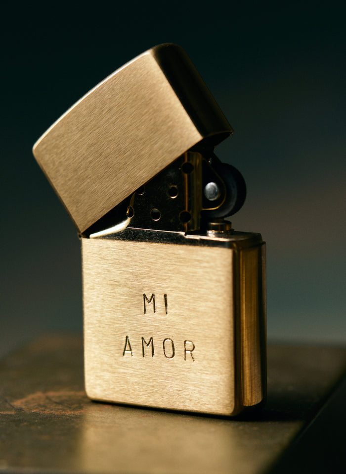 Tan hand stamped "mi amor" zippo