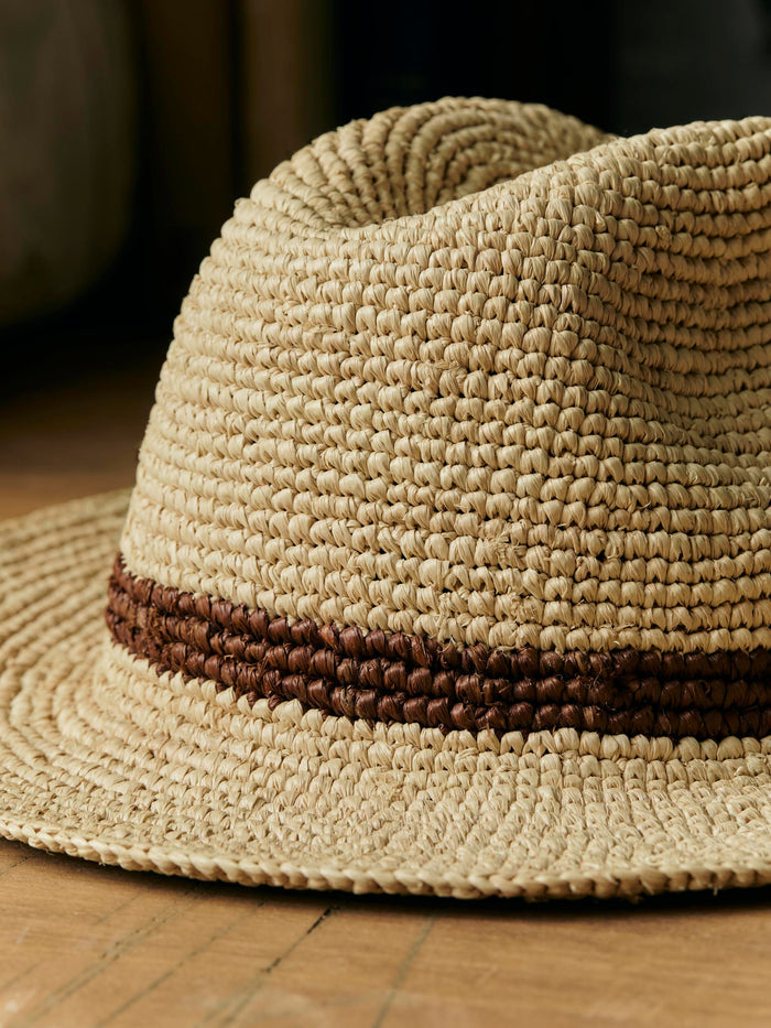 Black handwoven natural raffia palm hat