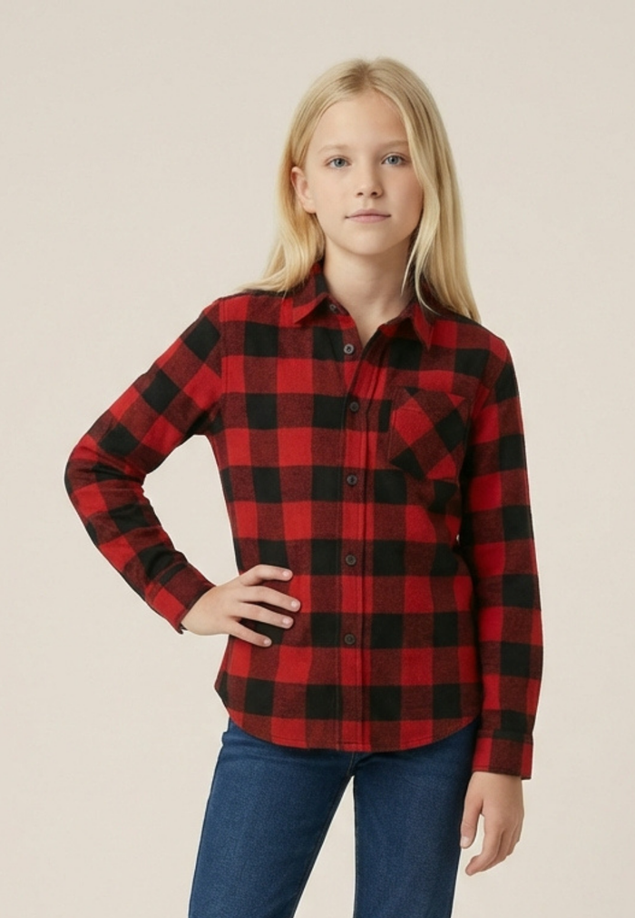 Youth girl wearing a unisex red and black buffalo check shirt with a plain background