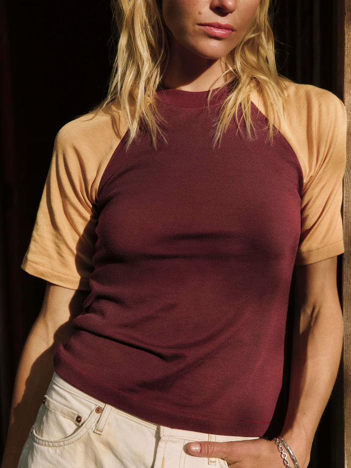 Black knit raglan crew in maroon