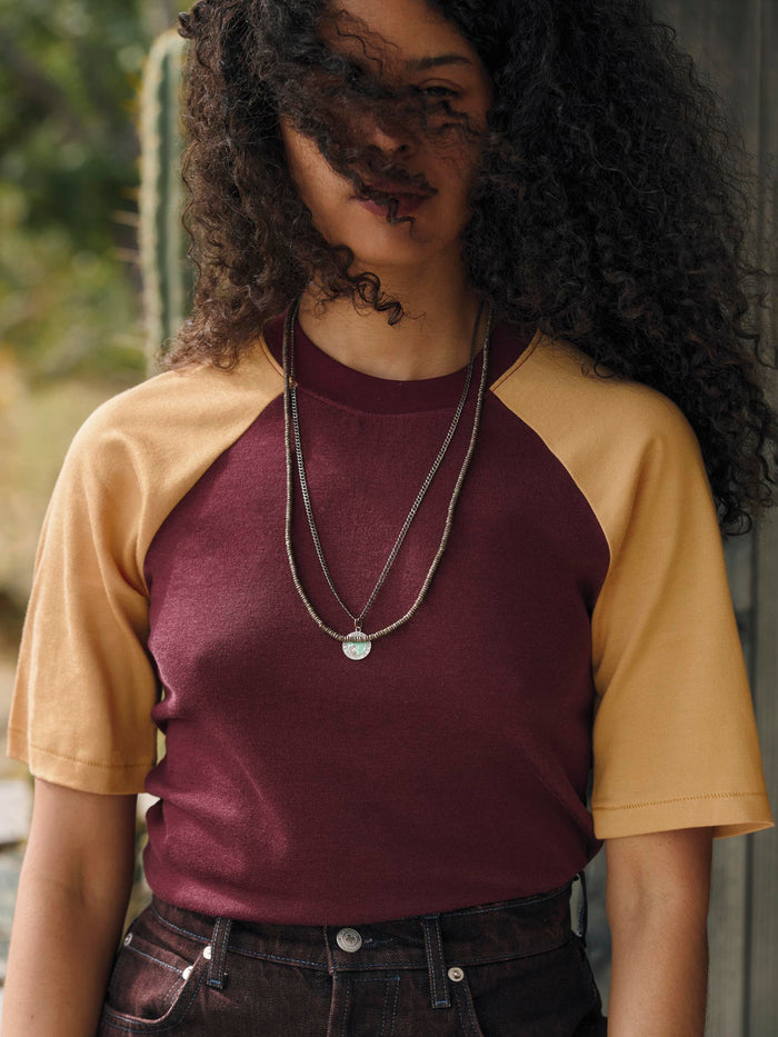 Black knit raglan crew in maroon