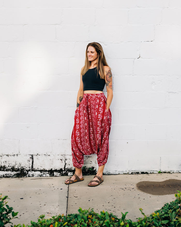 Woman standing outdoors in red lotus yoga pants #color_red lotus