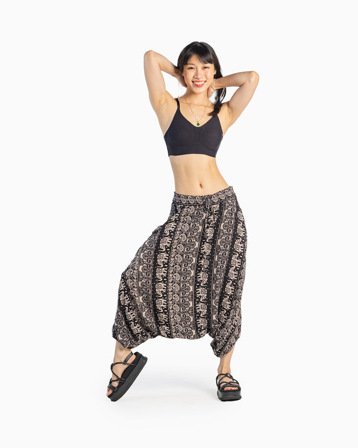 asian model wearing black lotus-pattern harem pants with relaxed look #color_black lotus