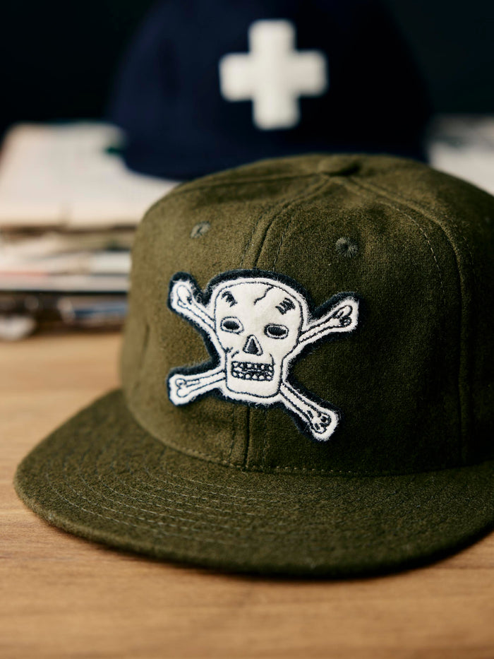 Tan the wool "hellcats" cap in olive