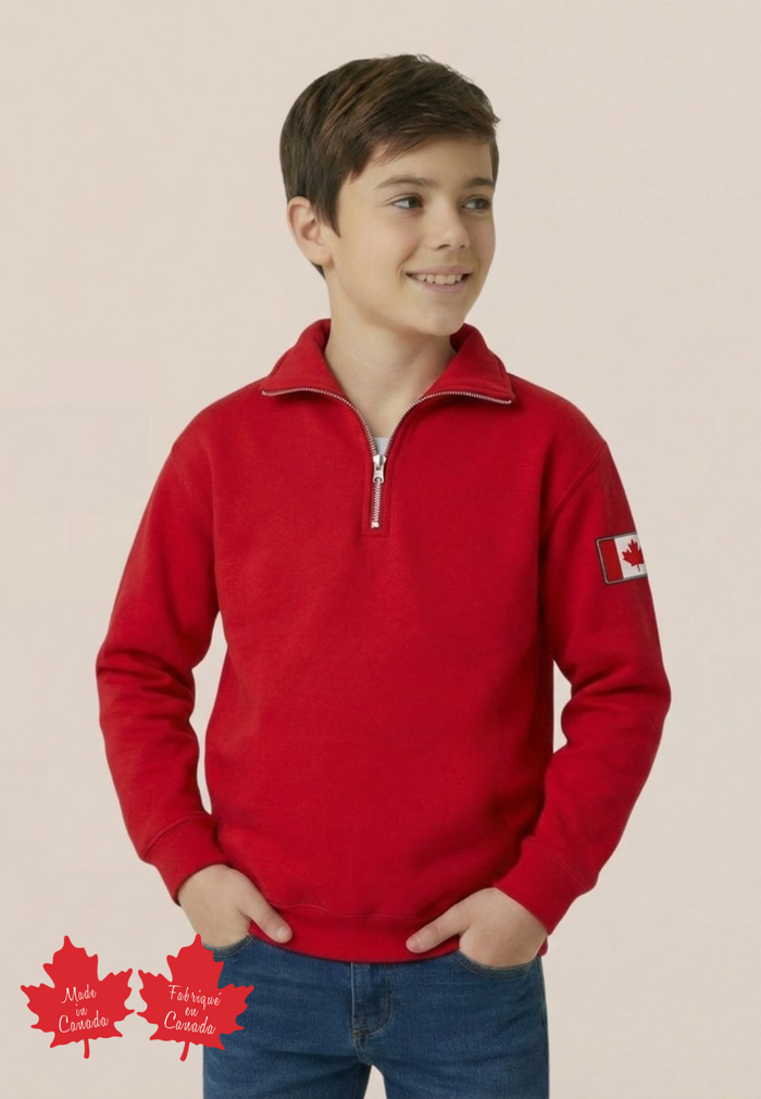 Child wearing a red polo with a Canadian flag patch on a beige background